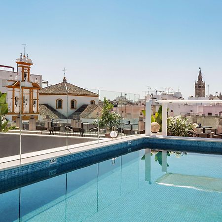 塞维利亚马格达莱纳广场丽笙精选酒店 外观 照片 Rooftop pool at Hotel Casa 1800